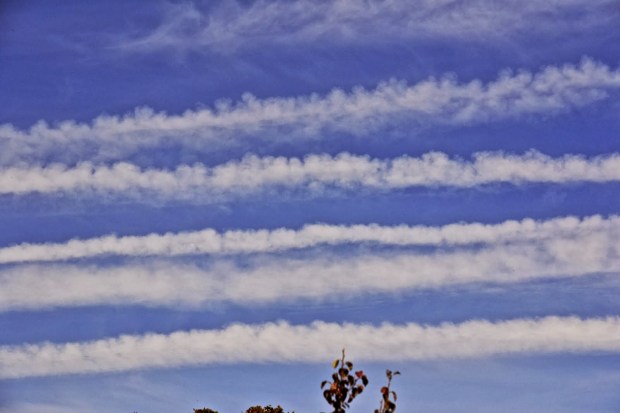 AERIAL SPRAYING WHICH RESULTS IN CLOUD COVER